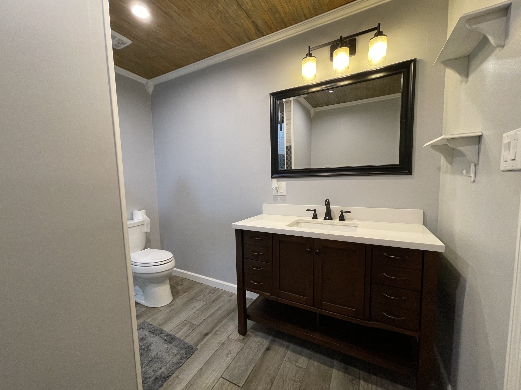 312 Gentry Street Tullahoma, TN 37388 - Photo 15 of 29 a bathroom with a toilet sink and mirror