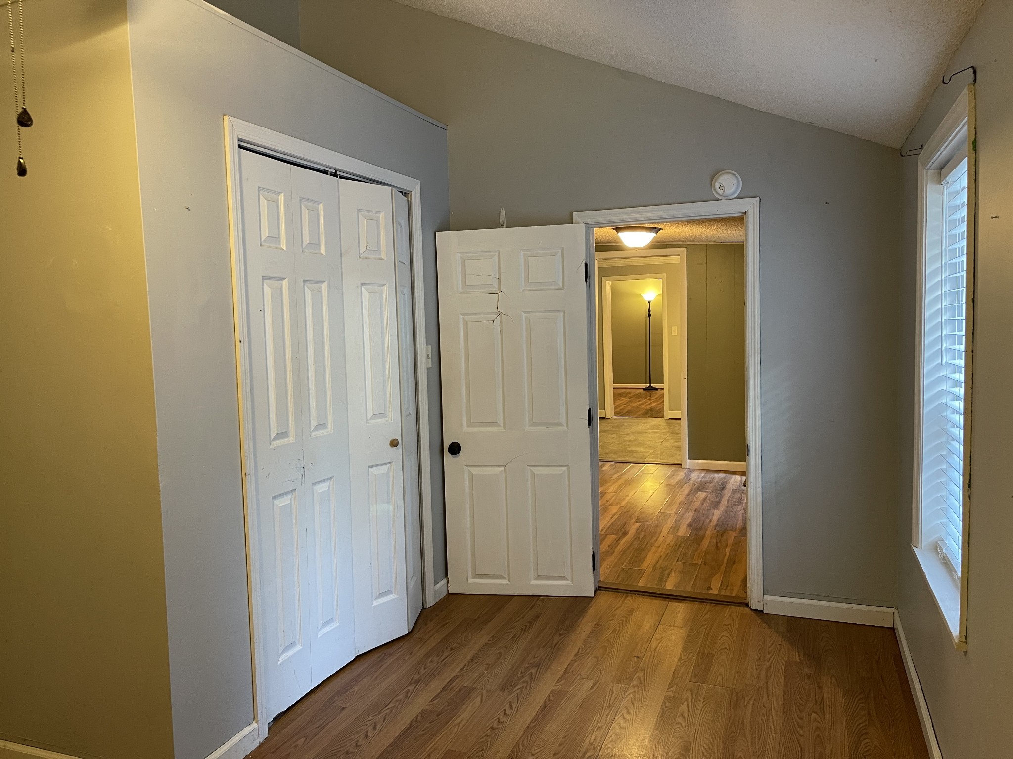 312 Gentry Street Tullahoma, TN 37388 - Photo 19 of 29 a view of empty room with wooden floor and wooden door