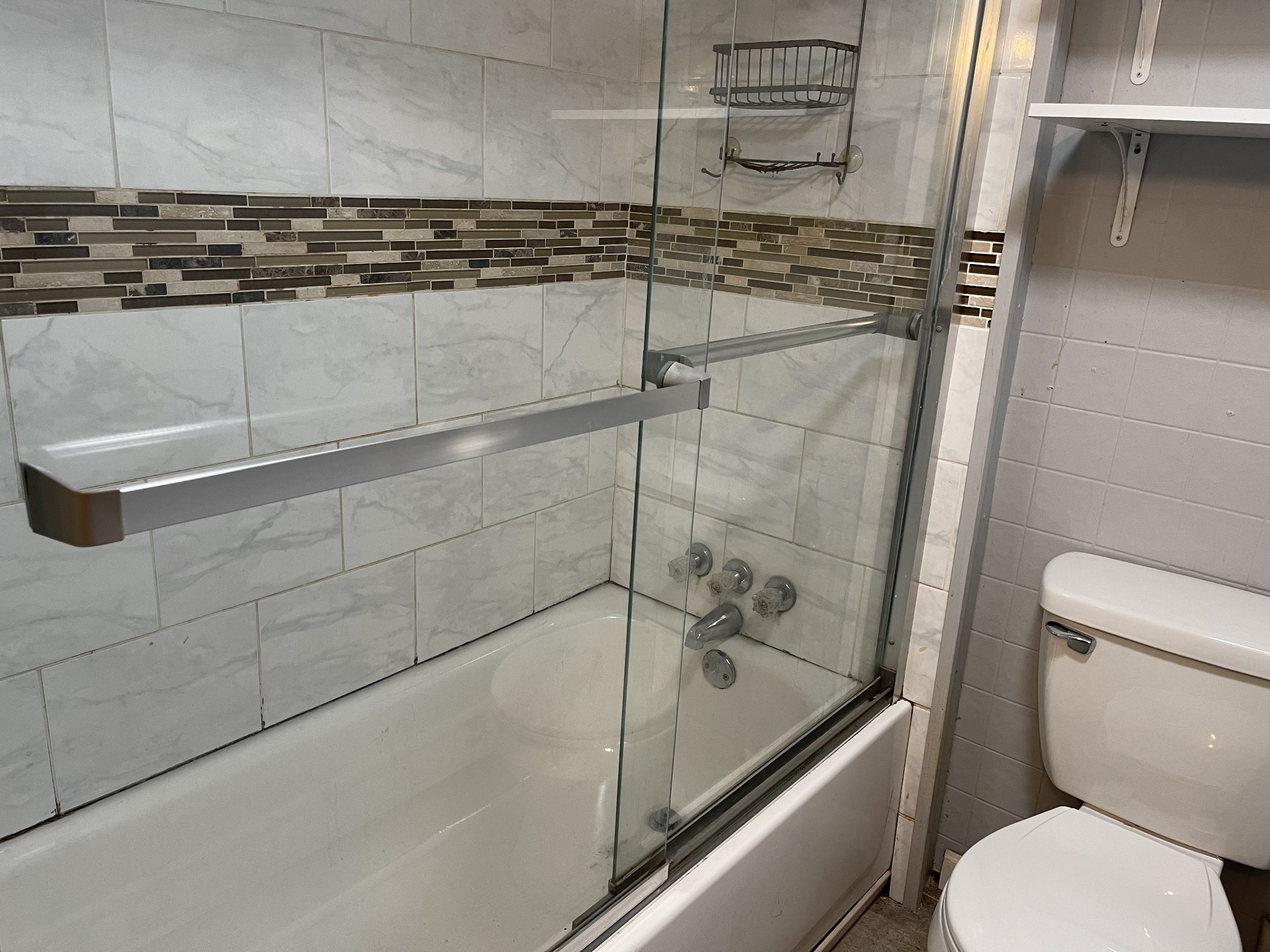 312 Gentry Street Tullahoma, TN 37388 - Photo 22 of 29 a bathroom with a shower and toilet