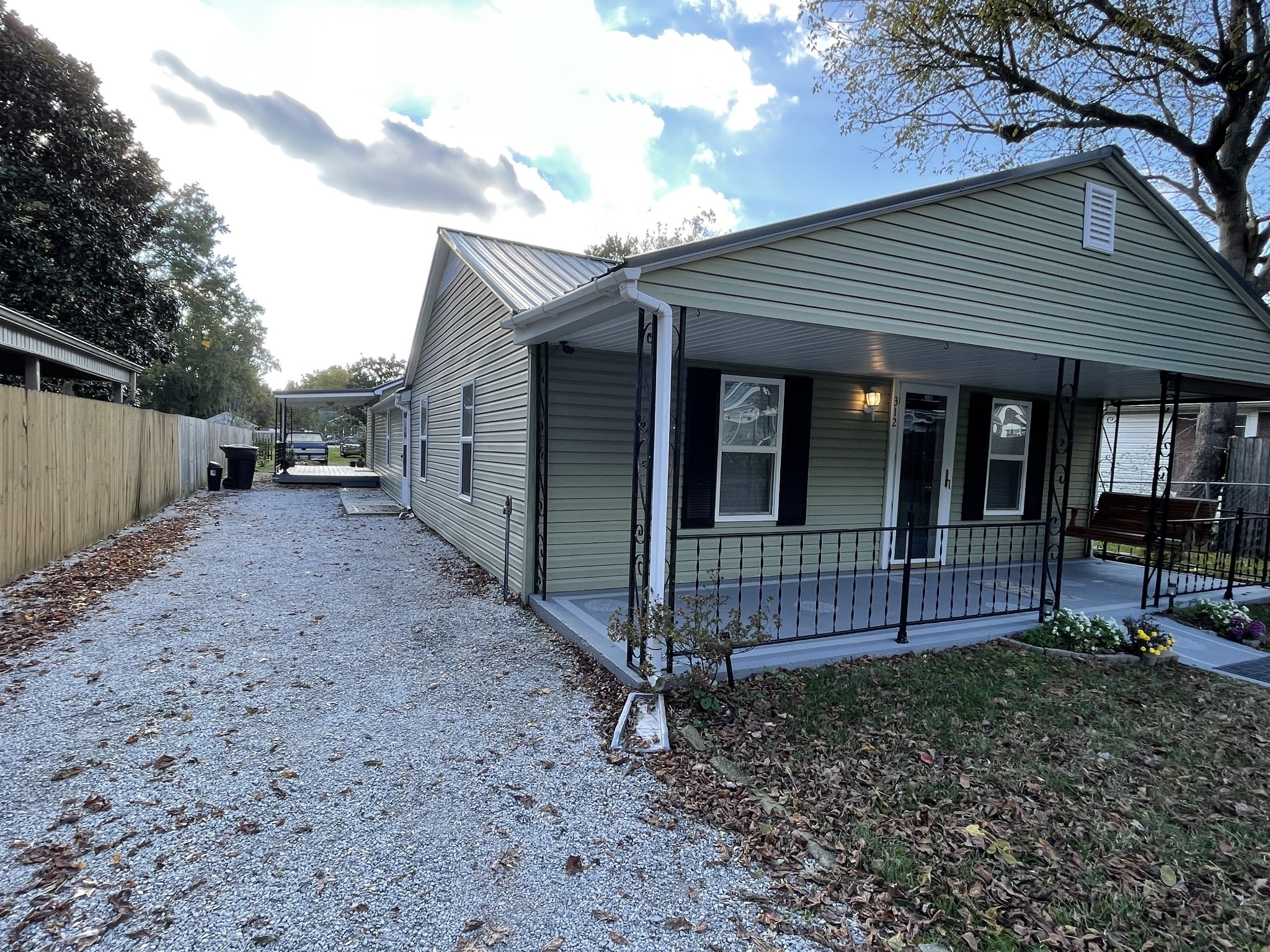 312 Gentry Street Tullahoma, TN 37388 - Photo 24 of 29 a view of a house with a yard and wooden fence