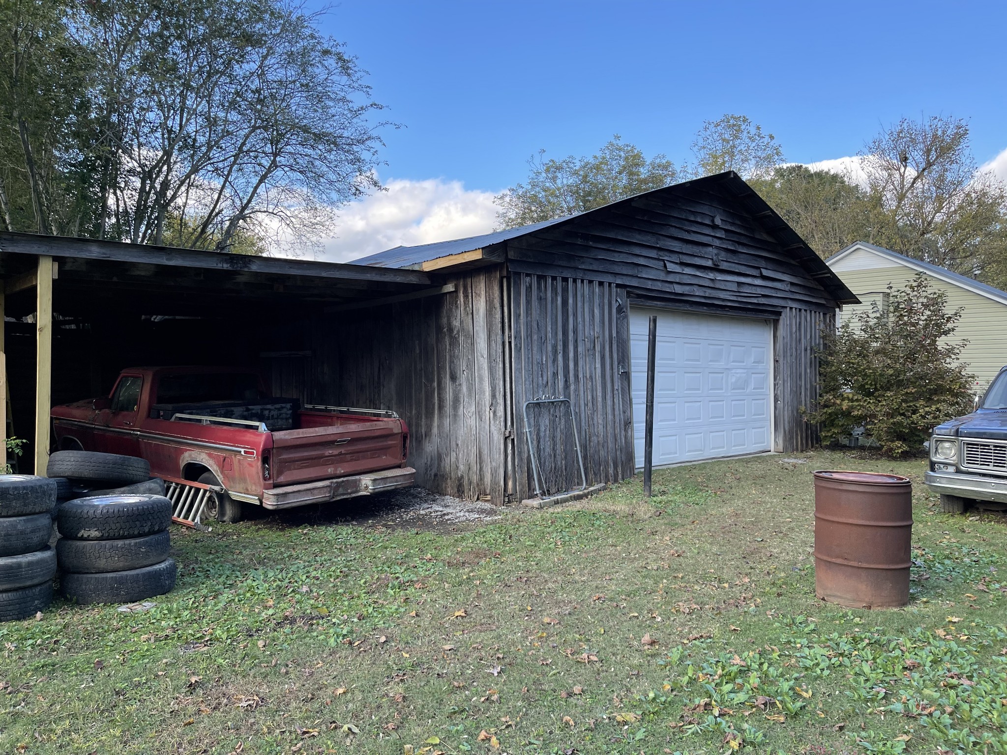 312 Gentry Street Tullahoma, TN 37388 - Photo 28 of 29 a view of backyard with barbeque grill and outdoor seating