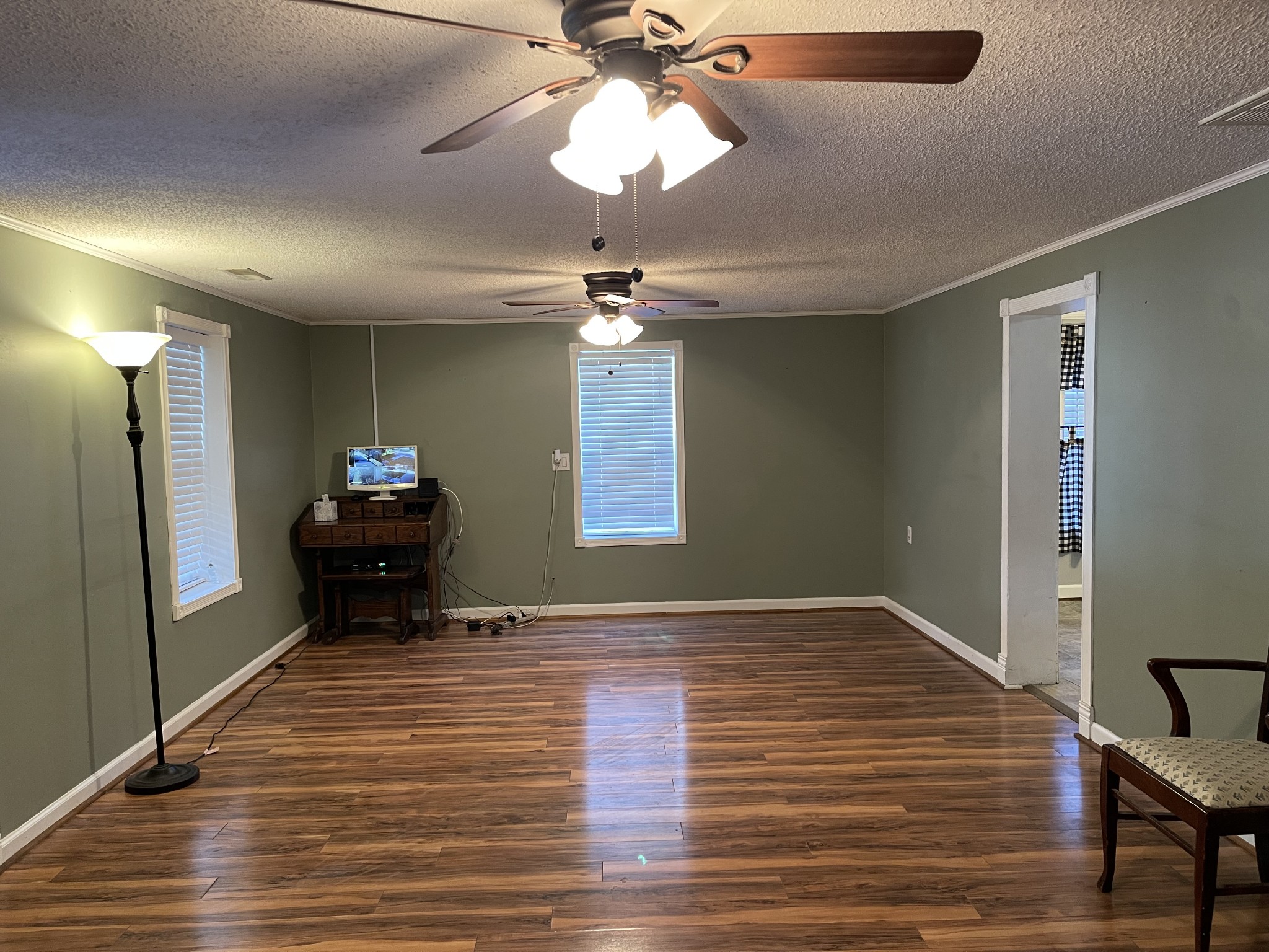 312 Gentry Street Tullahoma, TN 37388 - Photo 3 of 29 a view of a livingroom with a chandelier furniture and a ceiling fan