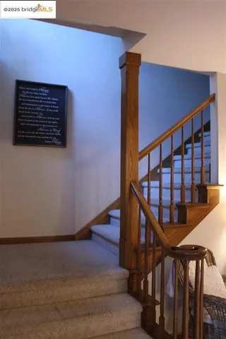 a spacious bedroom with bed and a chandelier