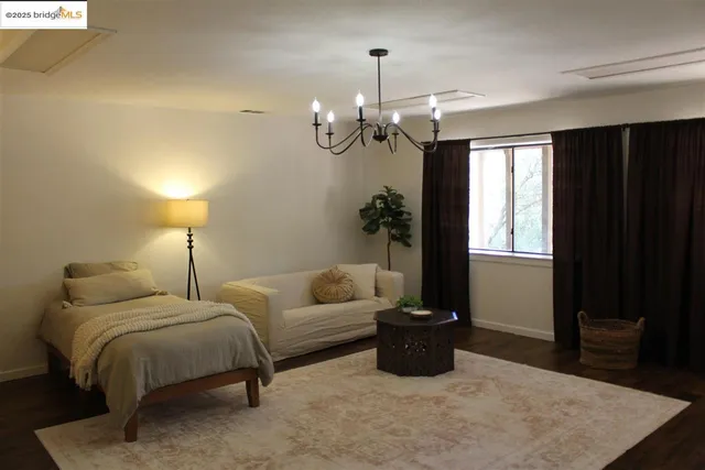 a living room with furniture and natural light