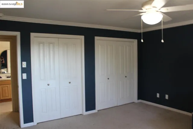 a room with a dresser and a window