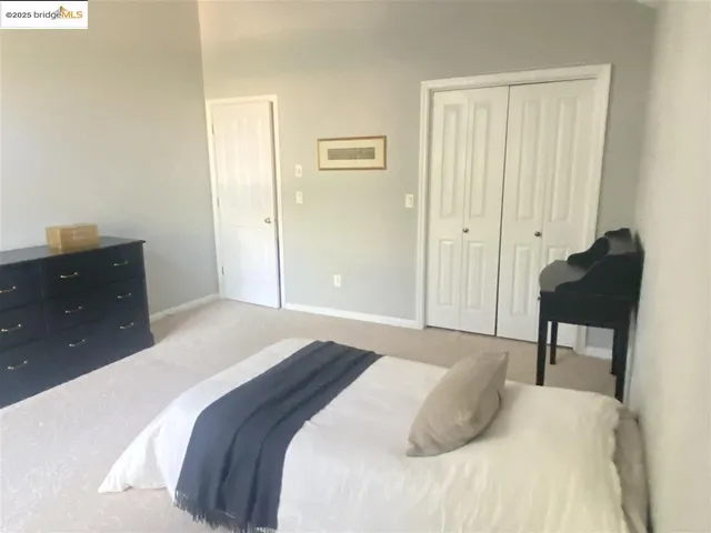 a view of room with a ceiling fan and a large window