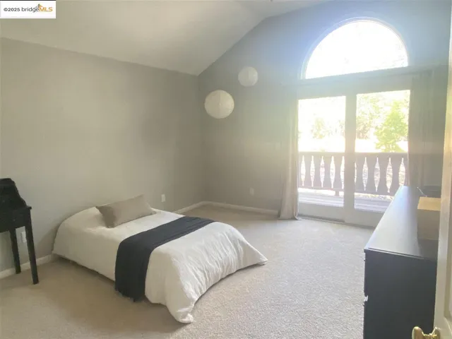 a view of a livingroom with a ceiling fan and window