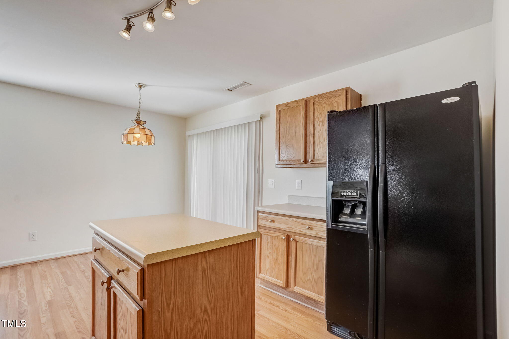 3705 Pinkham Way Raleigh, NC 27616 - Photo 11 of 29 a kitchen with a refrigerator and a sink