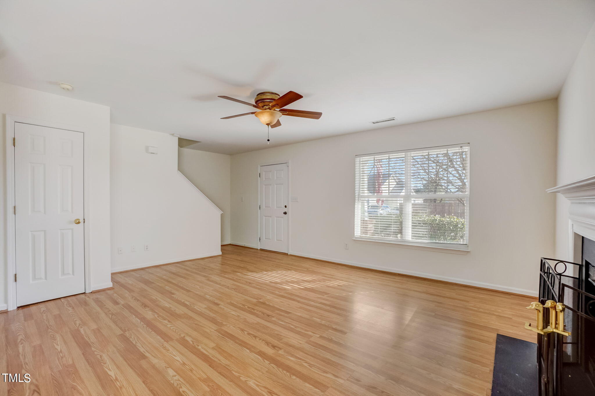 3705 Pinkham Way Raleigh, NC 27616 - Photo 7 of 29 a view of an empty room with a window and wooden floor