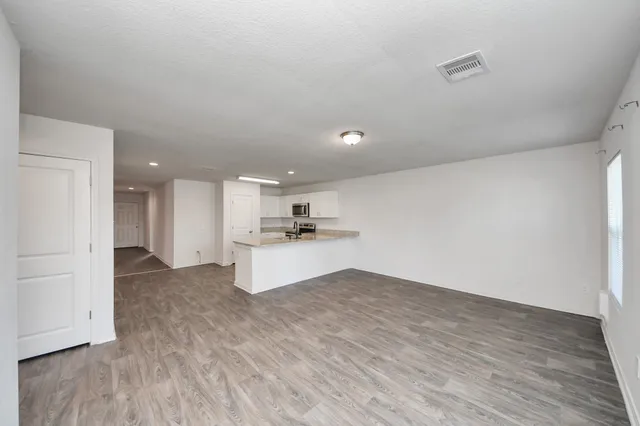 a view of kitchen with wooden floor