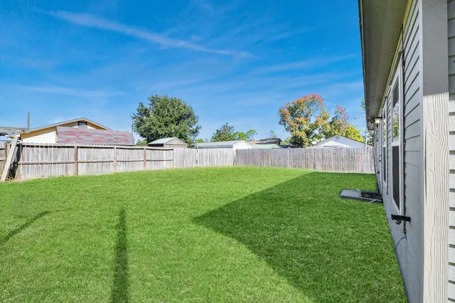 an aerial view of residential house with outdoor space