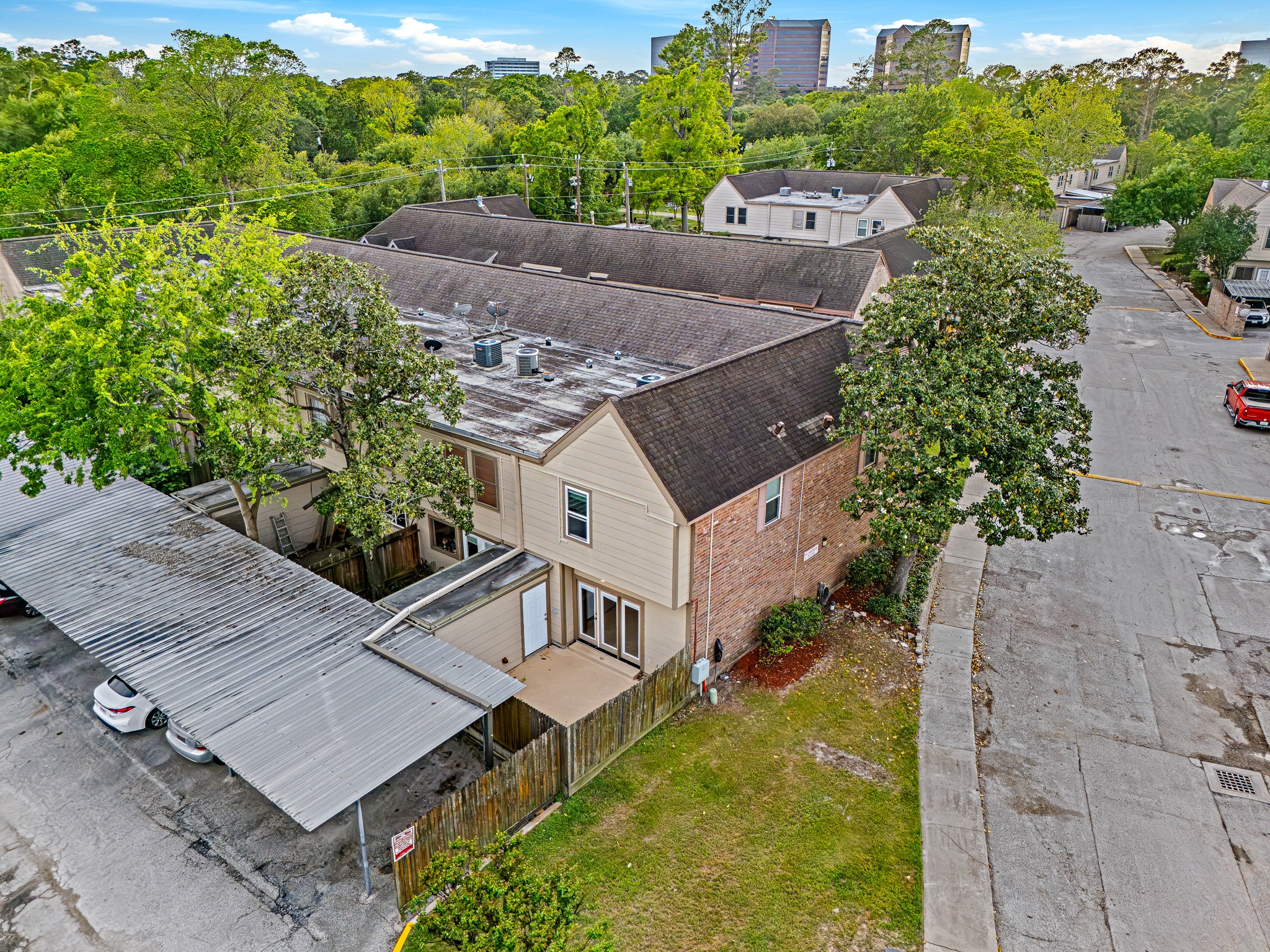 830 Threadneedle Street, Unit 240 Houston, TX 77079 - Photo 31 of 33 This townhouse offers a corner lot with a fenced yard and covered parking. It's surrounded by lush greenery, providing a serene setting, while still being close to urban amenities.