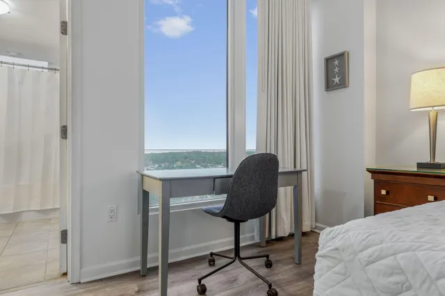 a bedroom with a bed and window