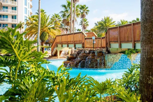 a view of a garden with a building in the background