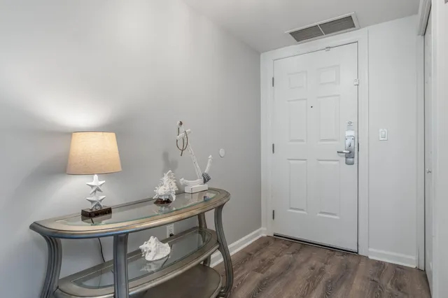 a view of a swimming pool with a patio and garden