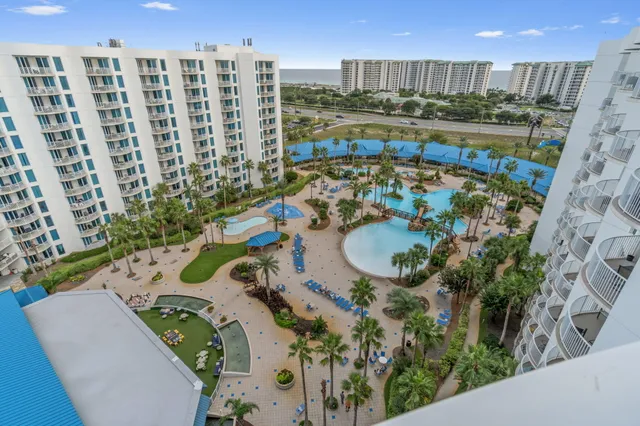 a view of swimming pool of a building with outdoor seating