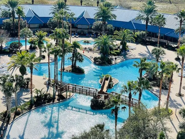 a dining room with furniture and a view of kitchen