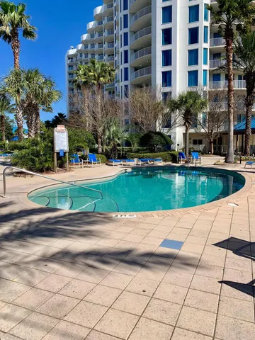 a view of a swimming pool with a house