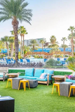 a living room with lots of furniture dining table and a flat screen tv
