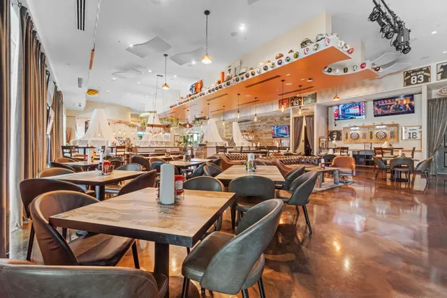 a view of a chairs and table in backyard of the house