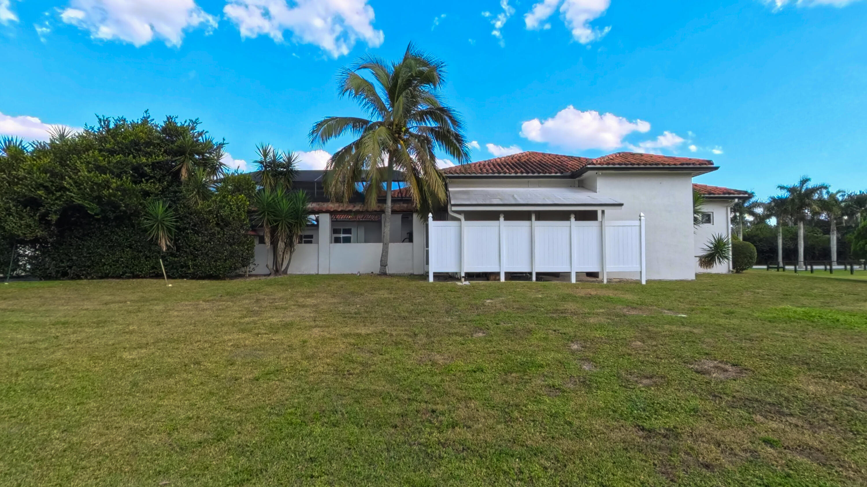 14225 43rd Road North Loxahatchee, FL 33470 - Photo 12 of 108 a front view of a house with a garden and yard