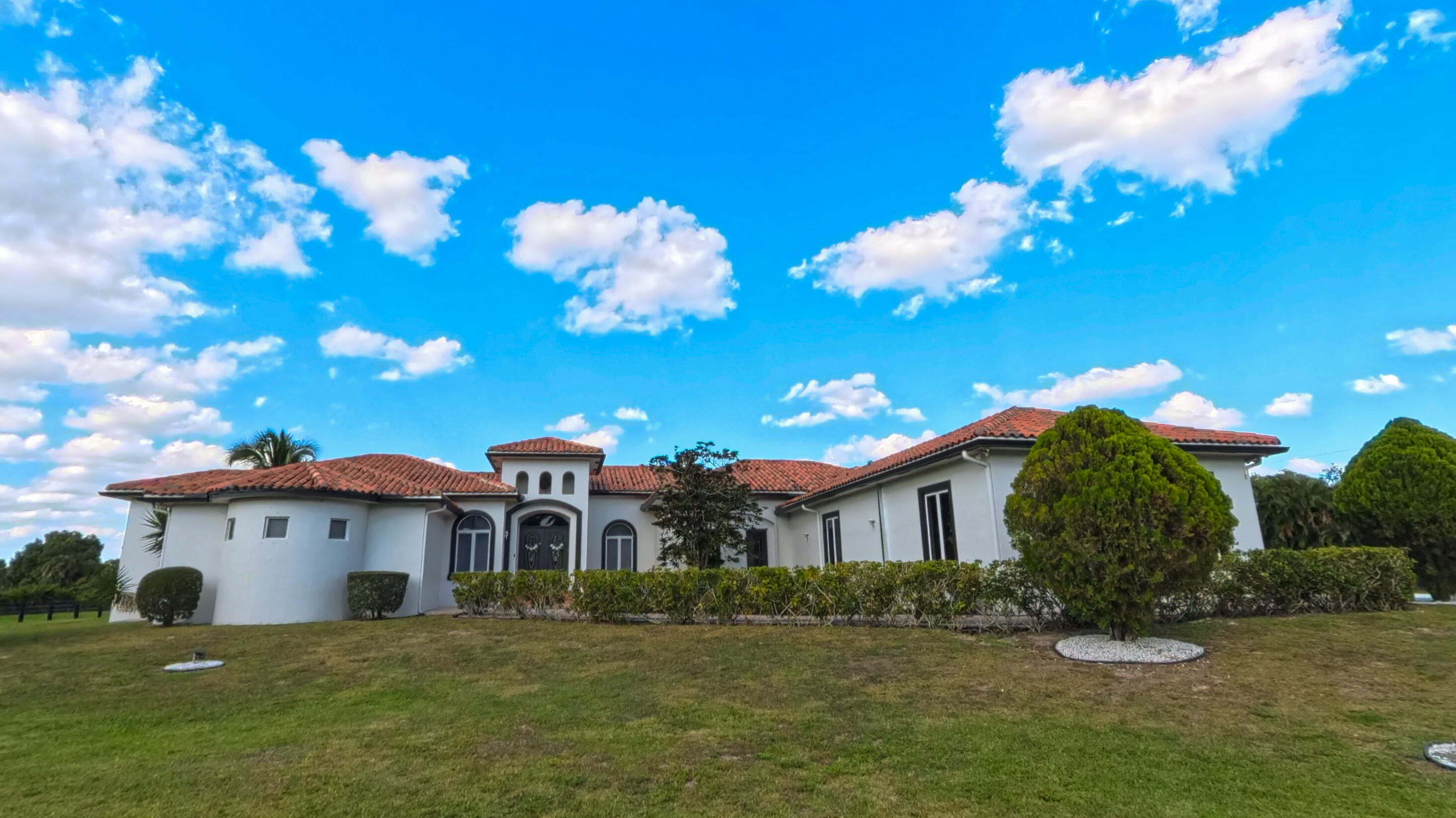 14225 43rd Road North Loxahatchee, FL 33470 - Photo 2 of 108 a view of a house with a big yard