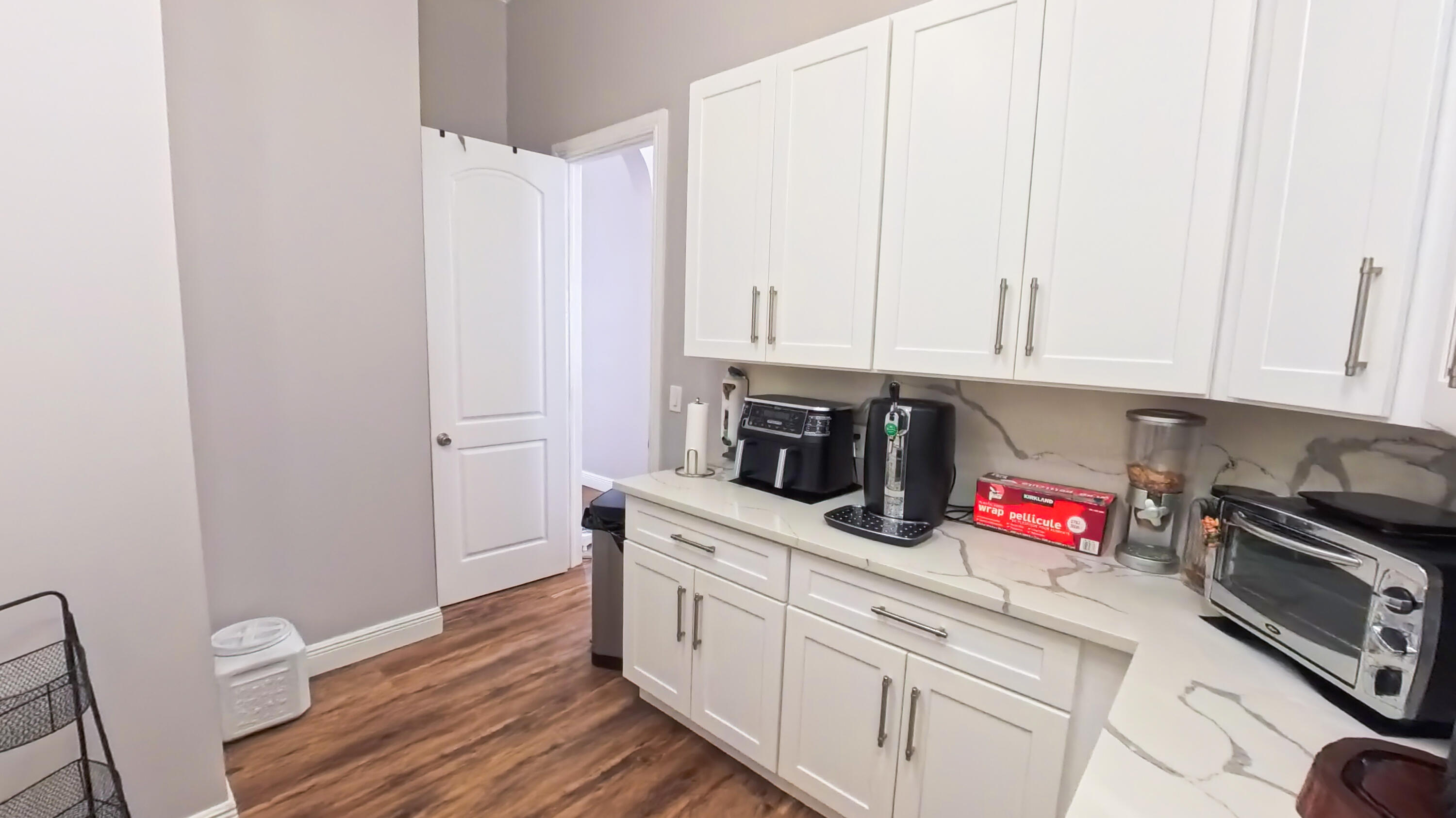 14225 43rd Road North Loxahatchee, FL 33470 - Photo 30 of 108 a kitchen with stainless steel appliances granite countertop a sink dishwasher a stove and white cabinets with wooden floor