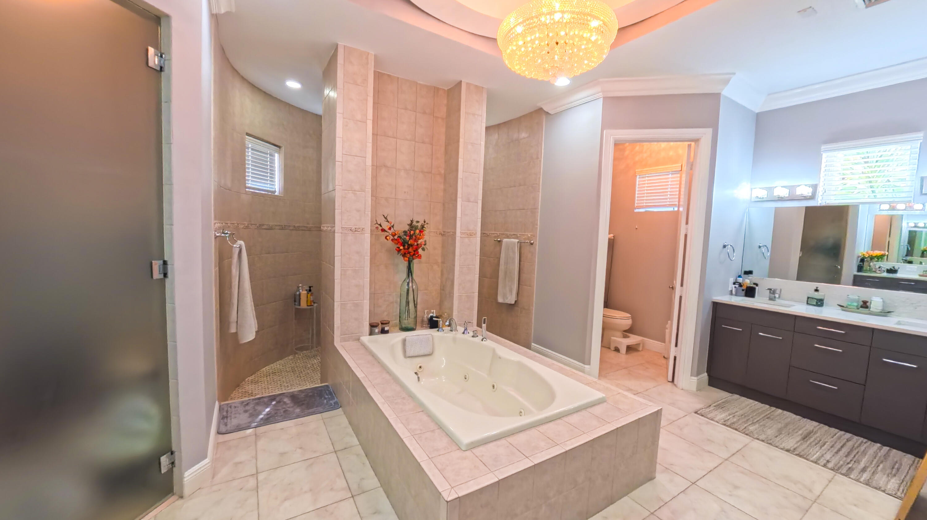 14225 43rd Road North Loxahatchee, FL 33470 - Photo 41 of 108 a spacious bathroom with a tub sink and mirror