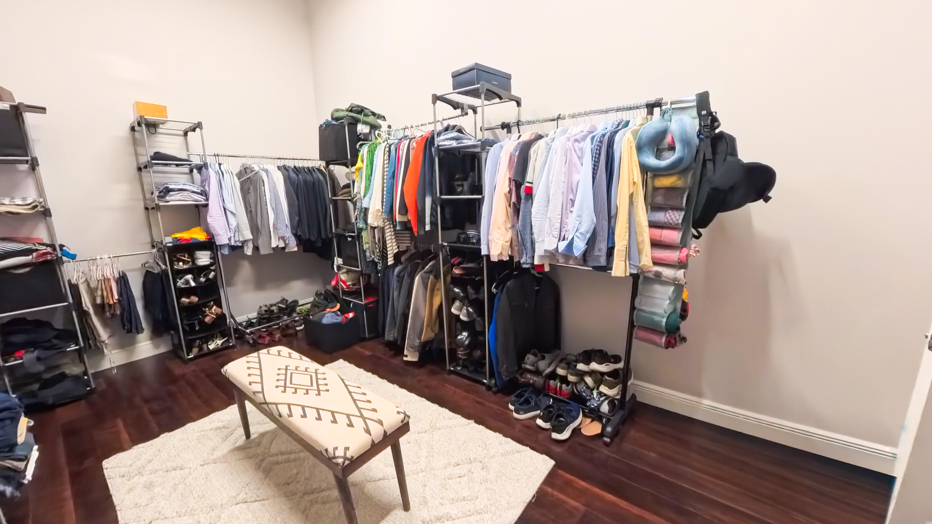 14225 43rd Road North Loxahatchee, FL 33470 - Photo 43 of 108 a view of walk in closet with clothes and shoes