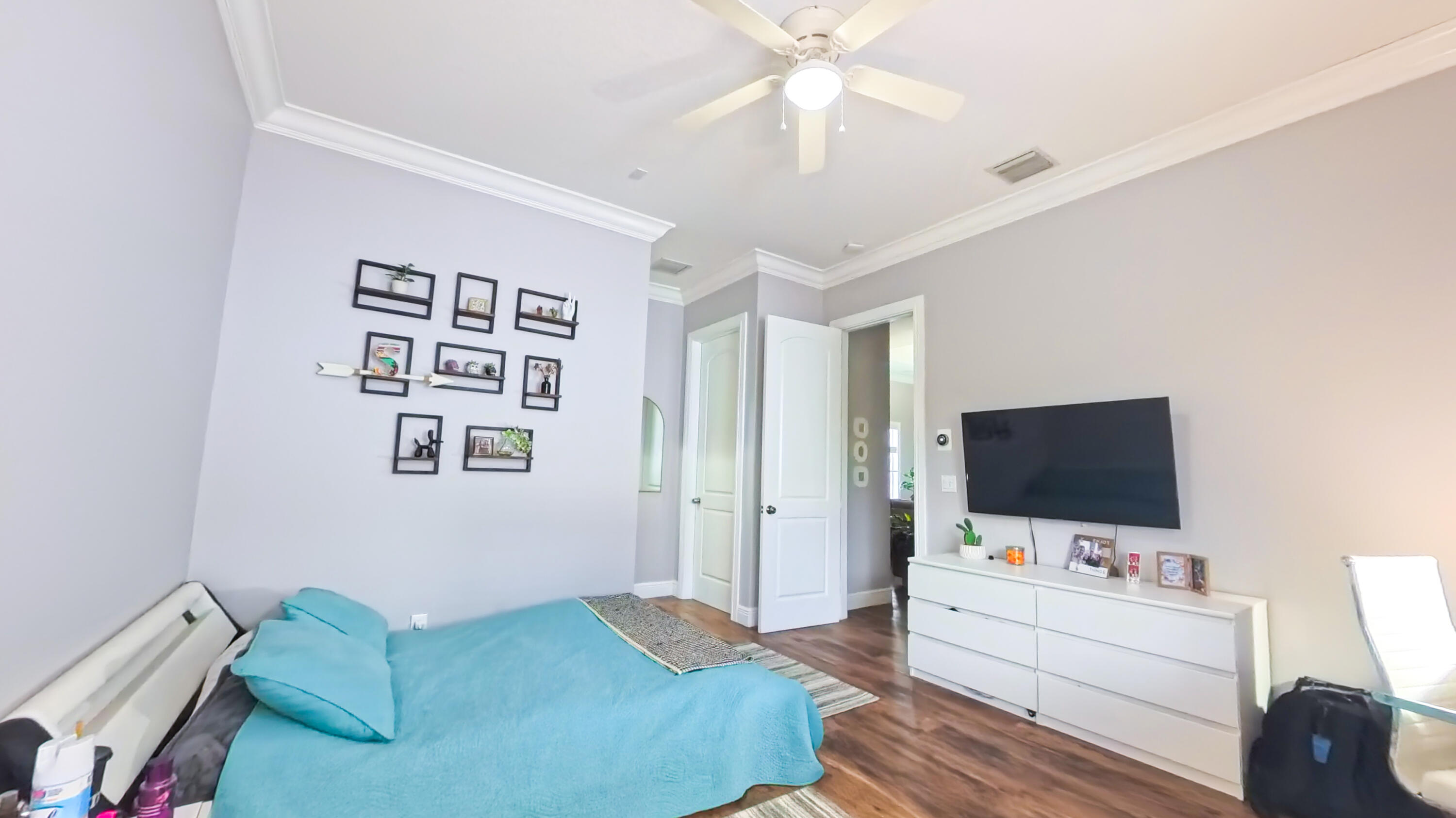 14225 43rd Road North Loxahatchee, FL 33470 - Photo 55 of 108 a bedroom with a bed and a flat screen tv