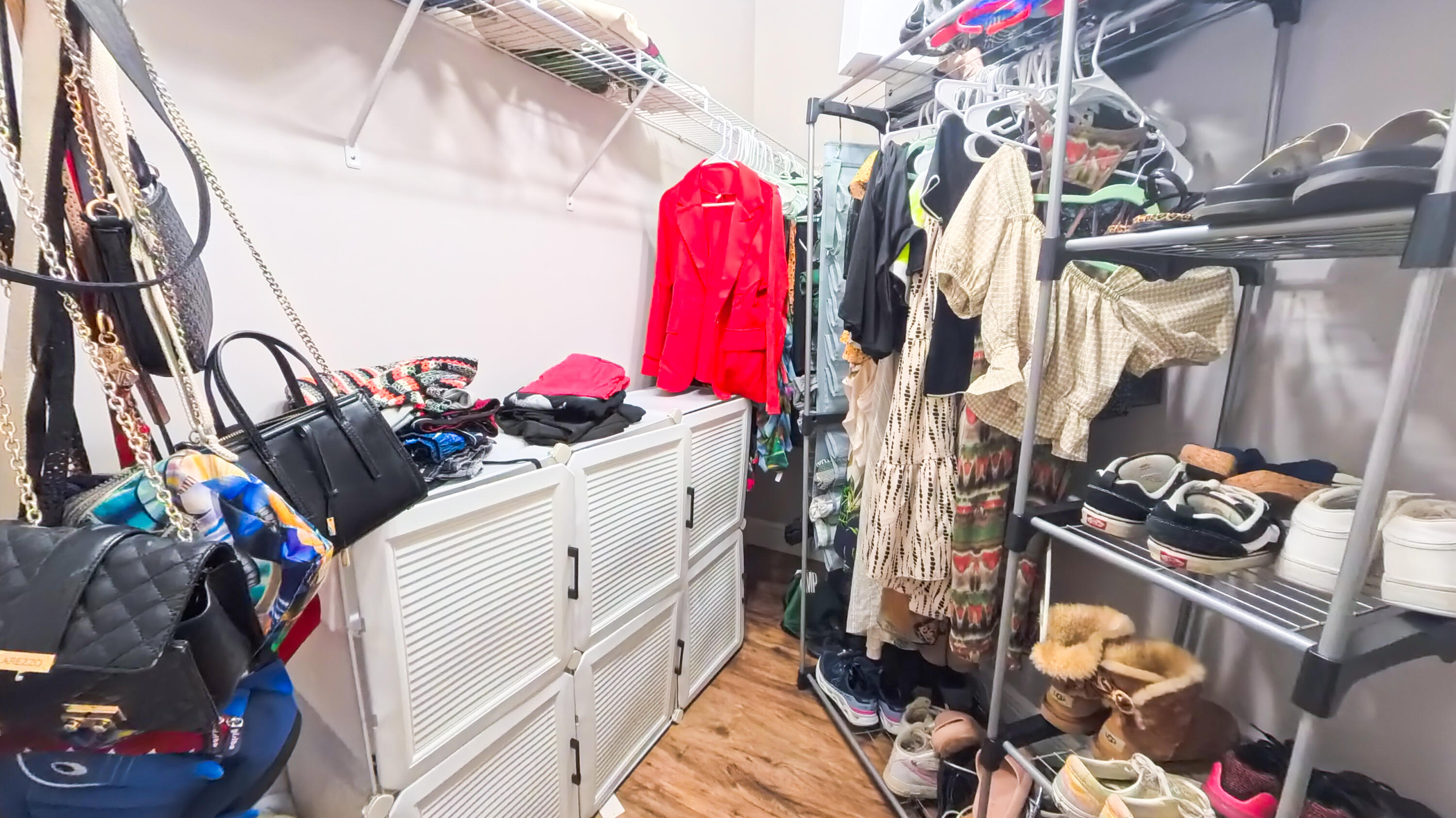 14225 43rd Road North Loxahatchee, FL 33470 - Photo 56 of 108 a view of walk in closet with clothes and shoes