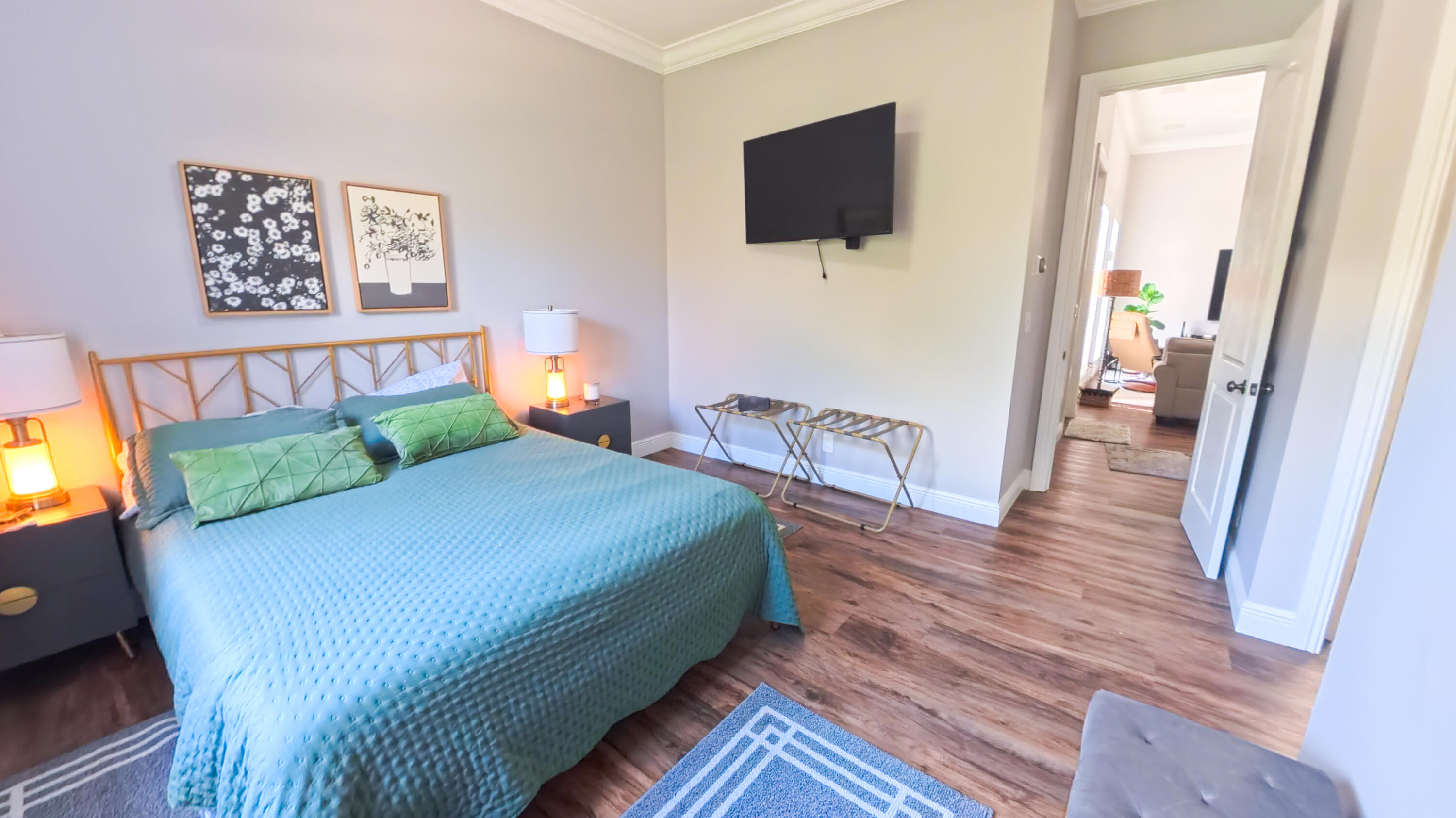 14225 43rd Road North Loxahatchee, FL 33470 - Photo 63 of 108 a bedroom with a bed a flat screen tv and a couch