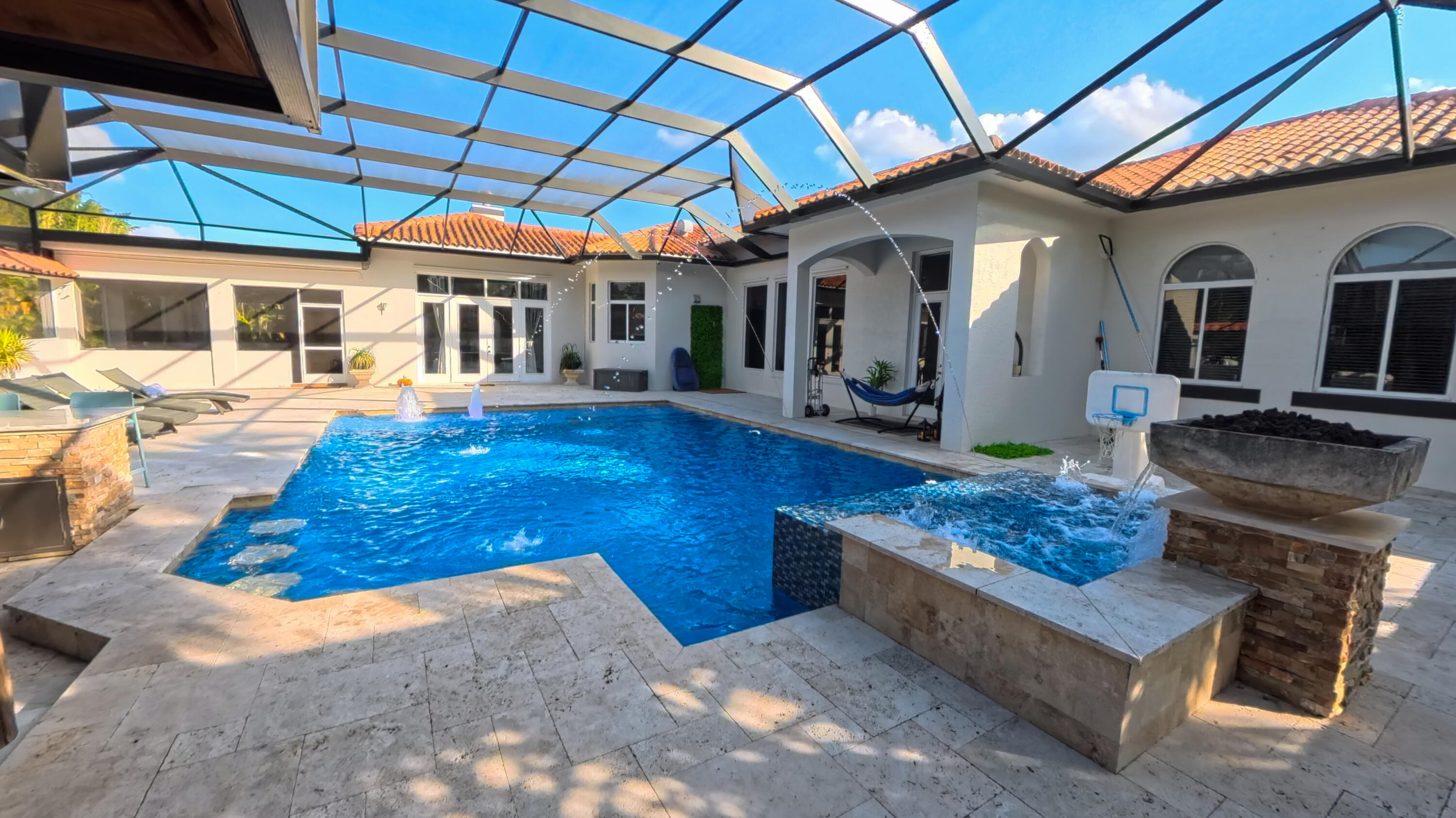 14225 43rd Road North Loxahatchee, FL 33470 - Photo 72 of 108 a view of a house with a chairs in a patio