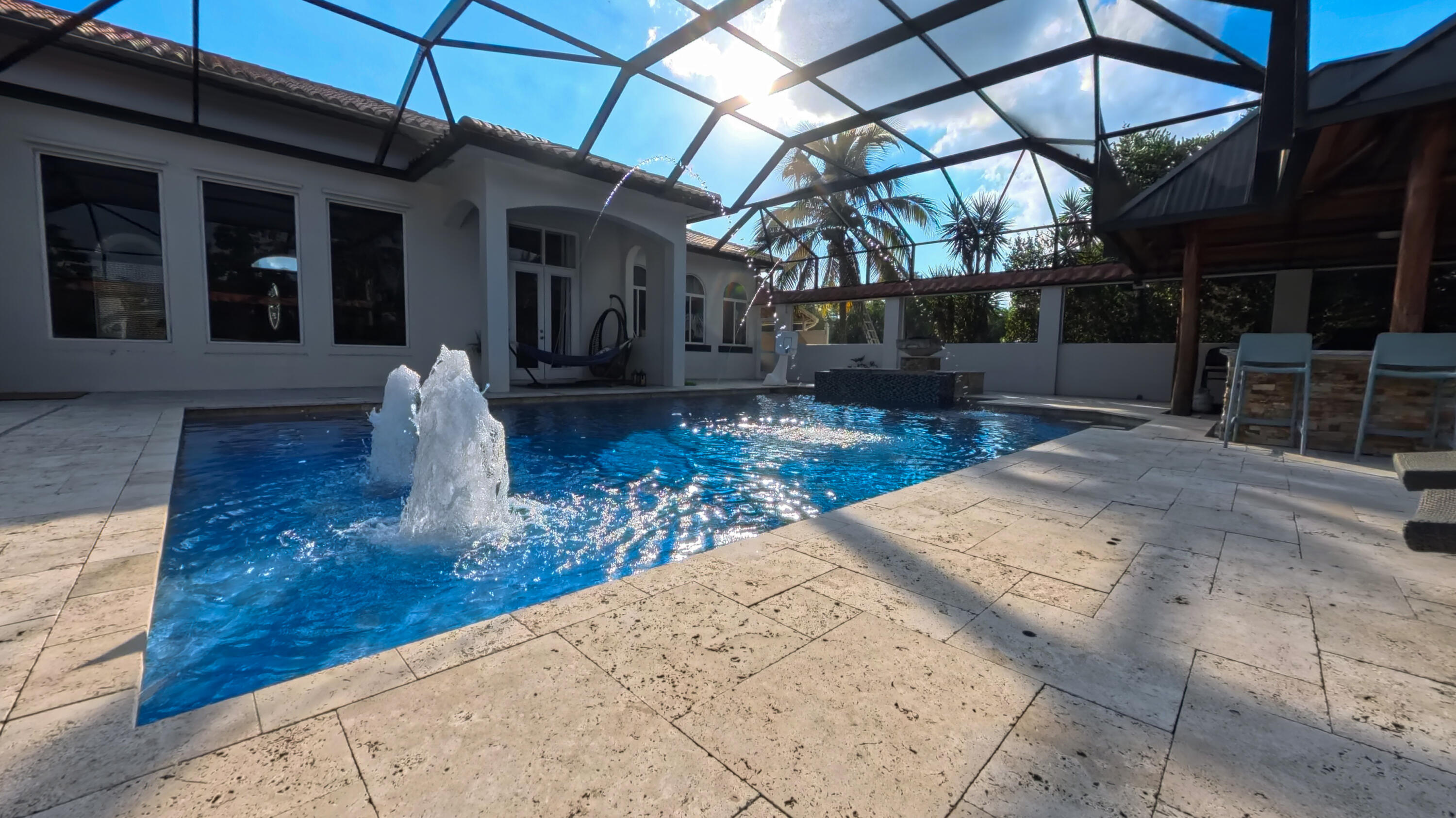14225 43rd Road North Loxahatchee, FL 33470 - Photo 73 of 108 a view of a backyard with table and chairs under an umbrella