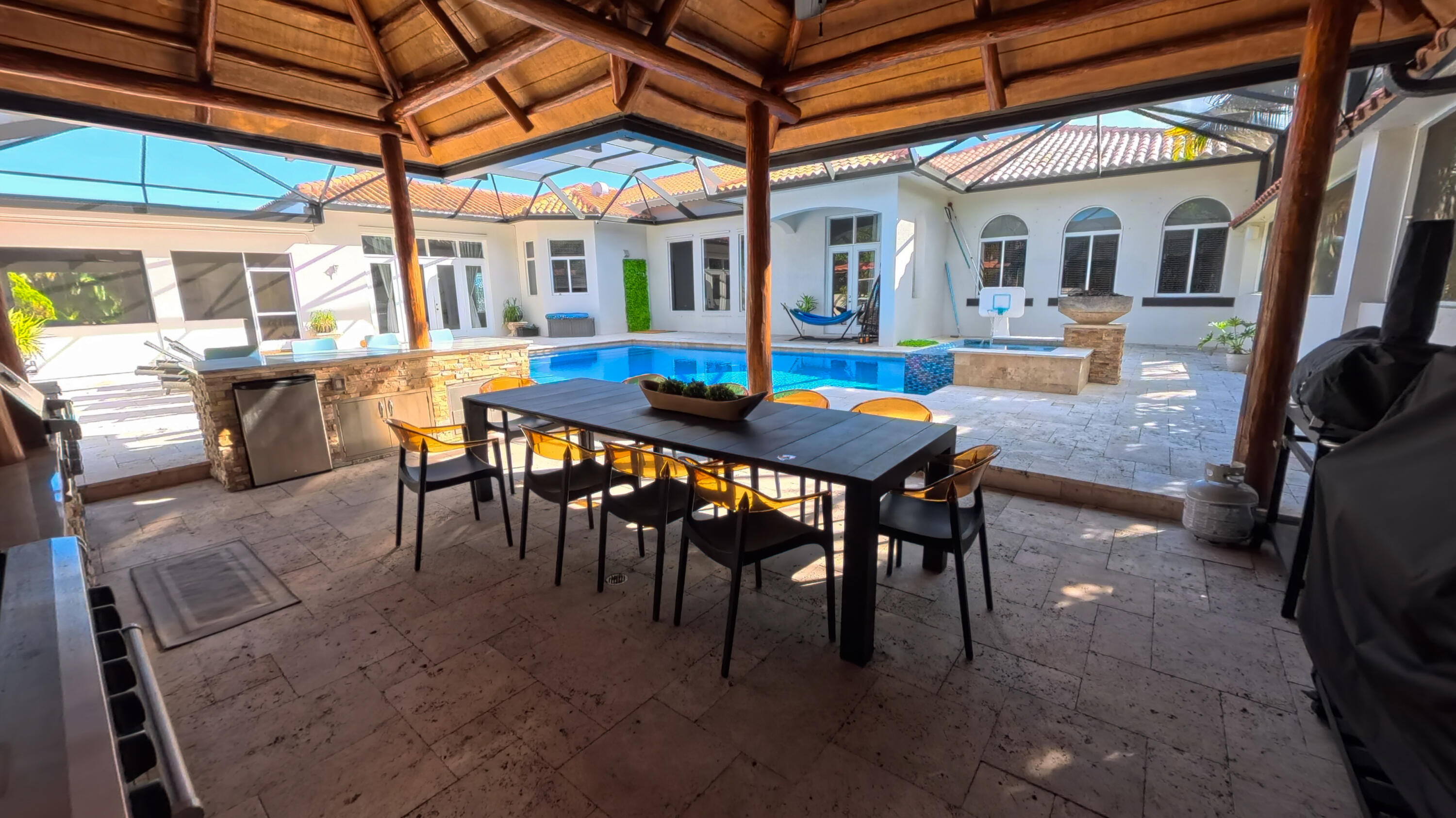 14225 43rd Road North Loxahatchee, FL 33470 - Photo 75 of 108 a view of a patio with a table and chairs