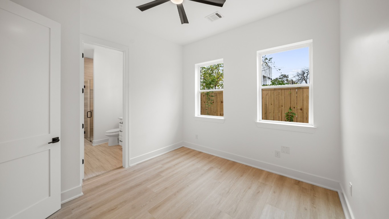 1908 Wheeler Avenue Houston, TX 77004 - Photo 11 of 43 wooden floor in an empty room with a window