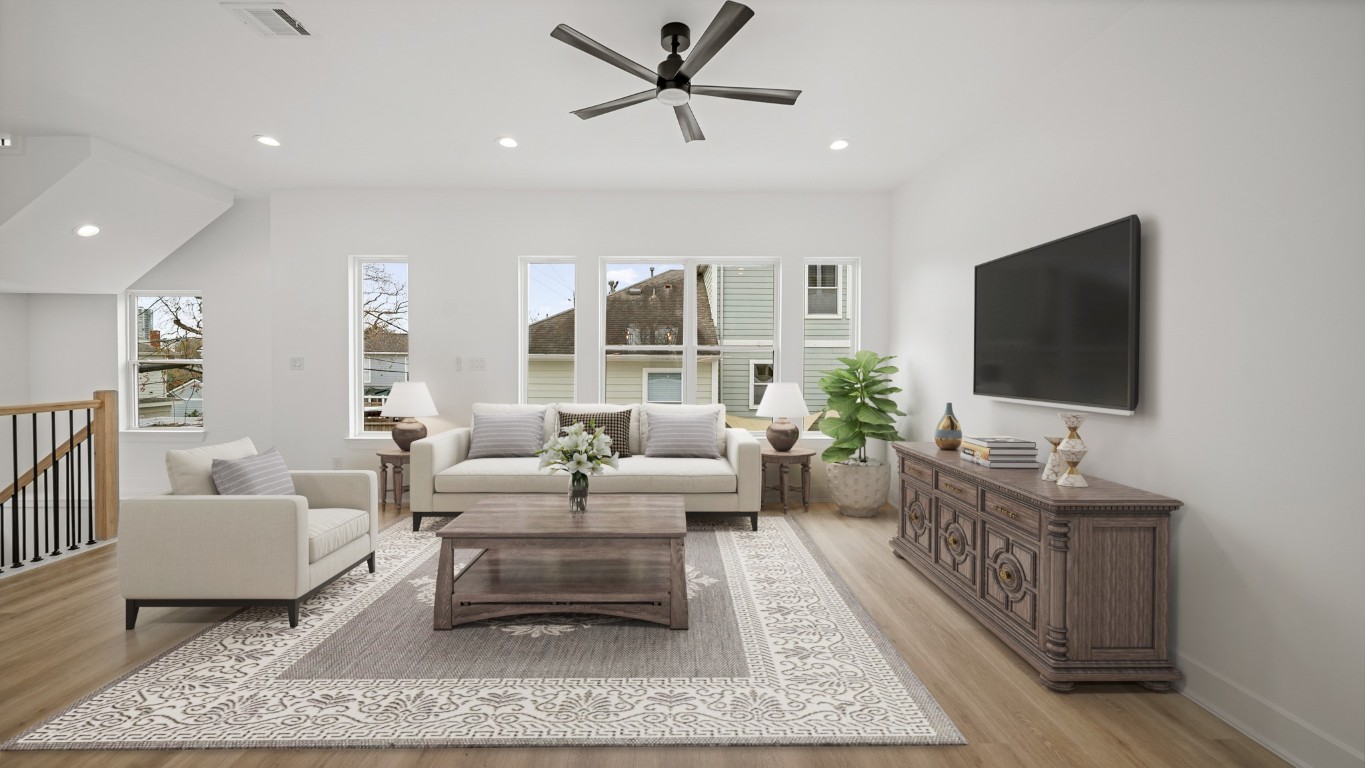 1908 Wheeler Avenue Houston, TX 77004 - Photo 15 of 43 a living room with furniture and a flat screen tv