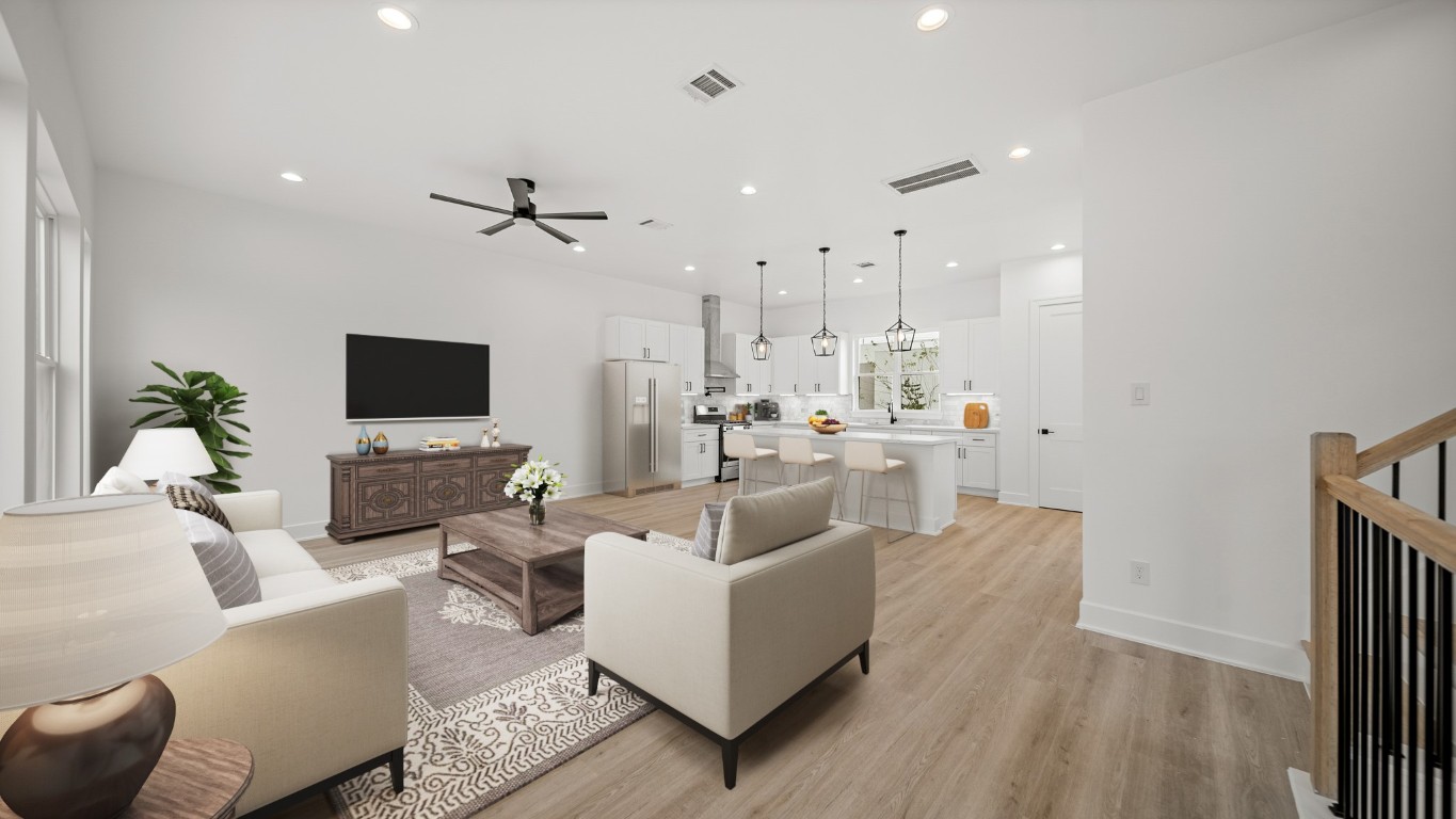 1908 Wheeler Avenue Houston, TX 77004 - Photo 18 of 43 a living room with furniture a flat screen tv and kitchen view