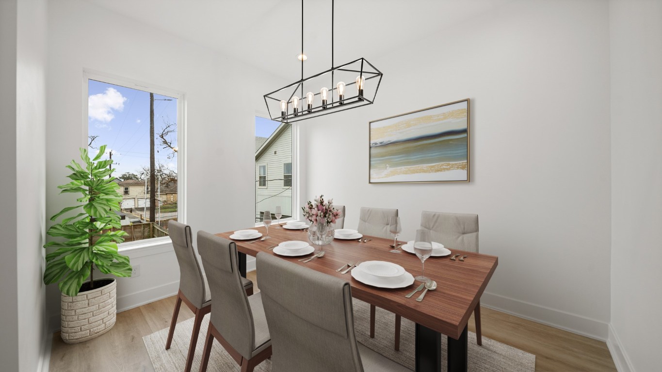1908 Wheeler Avenue Houston, TX 77004 - Photo 25 of 43 a view of a dining room with furniture and wooden floor