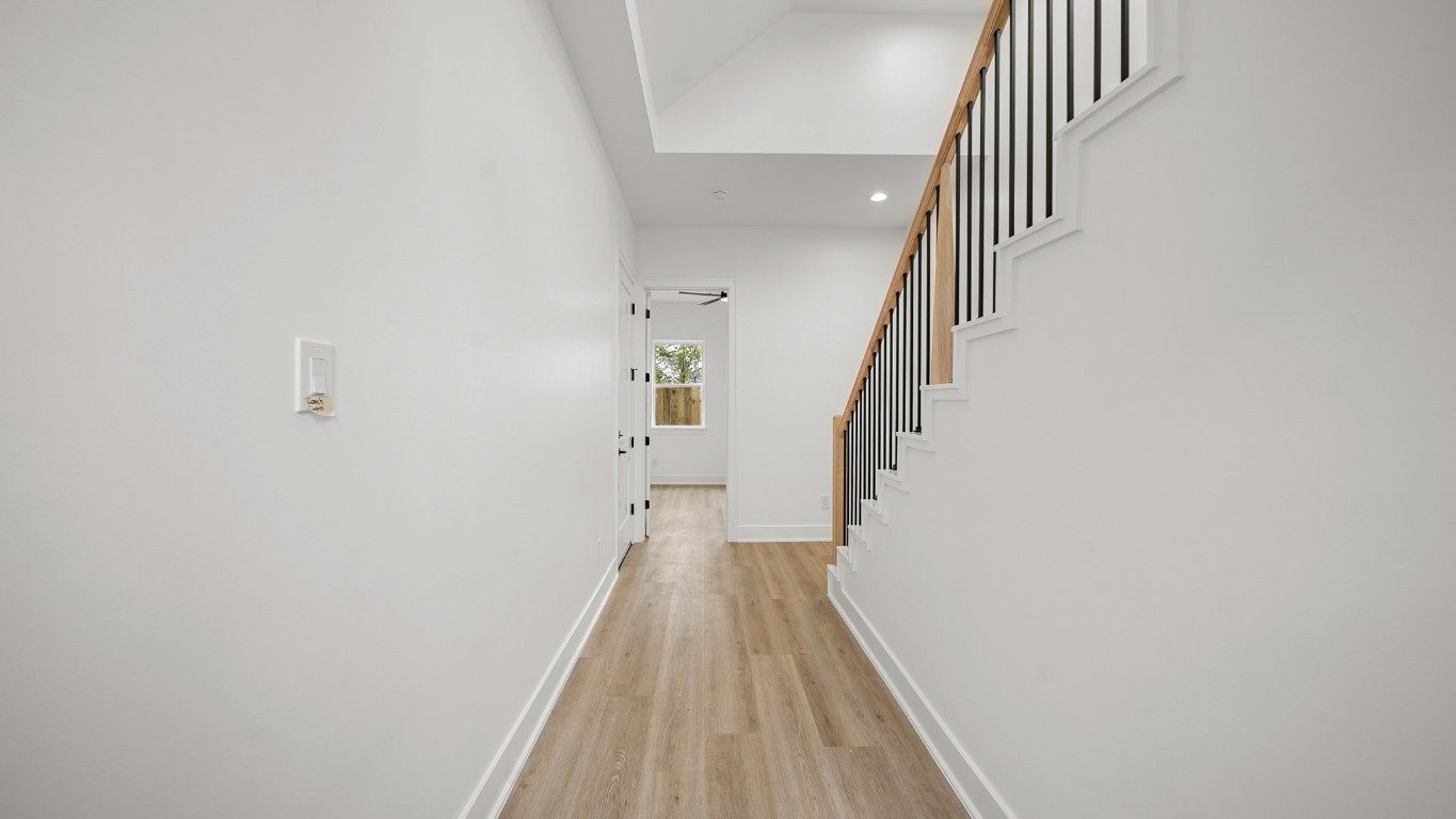 1908 Wheeler Avenue Houston, TX 77004 - Photo 9 of 43 a view of a hallway with wooden floor and entryway