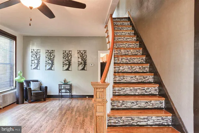 a view of an entryway with wooden floor
