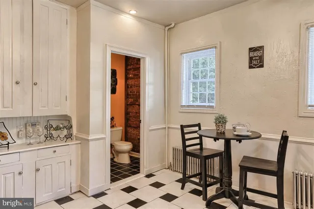 a view of a dining room with furniture and window
