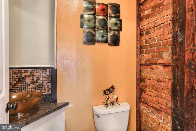 a bathroom with a toilet and sink