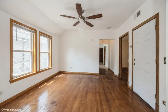 a kitchen with a stove a refrigerator and a sink