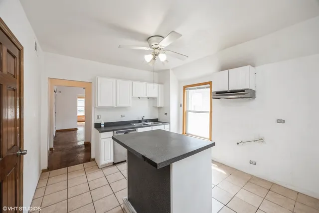 a view of room with window and wooden floor