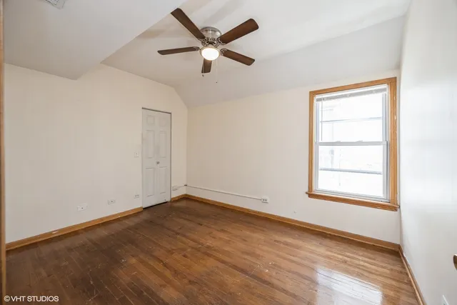a bathroom with a sink a window and a shower