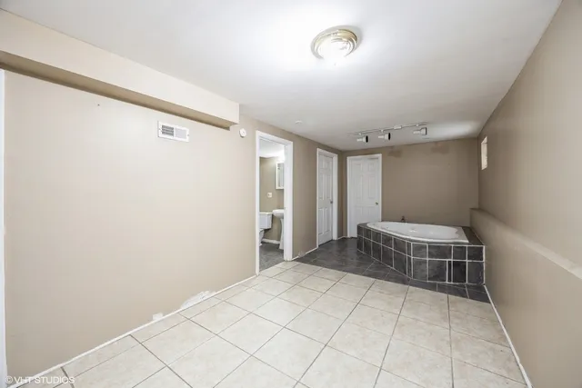 a bathroom with a sink toilet and a mirror