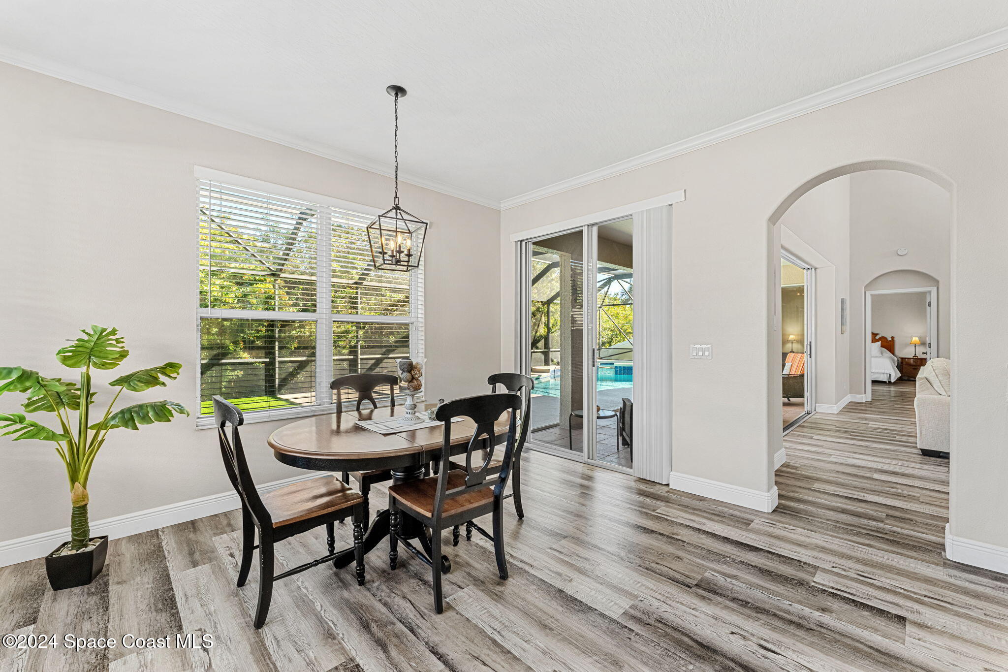 3416 Peninsula Circle Melbourne, FL 32940 - Photo 14 of 61 a view of a dining room with furniture window and wooden floor
