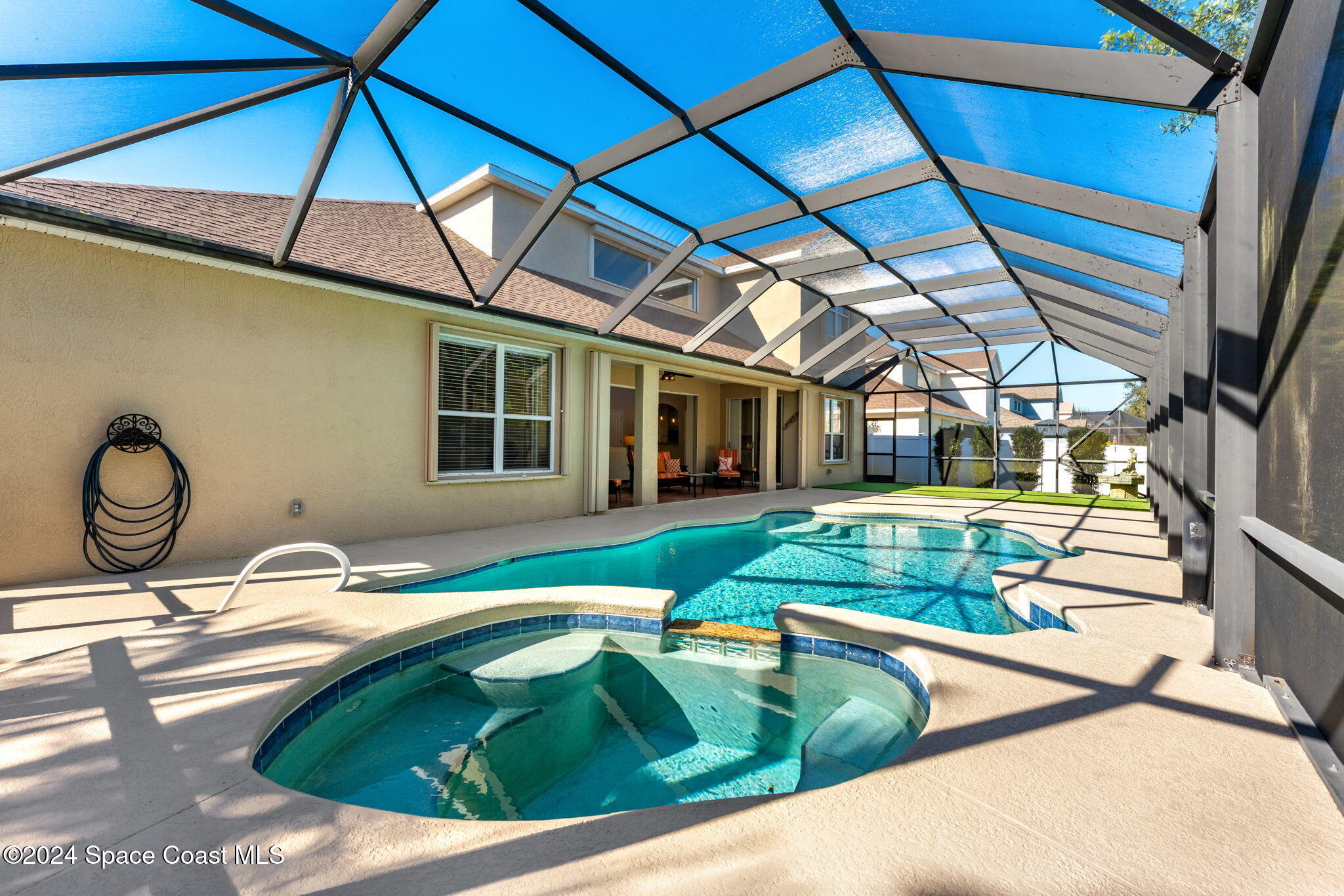 3416 Peninsula Circle Melbourne, FL 32940 - Photo 2 of 61 a view of swimming pool with a lounge chairs