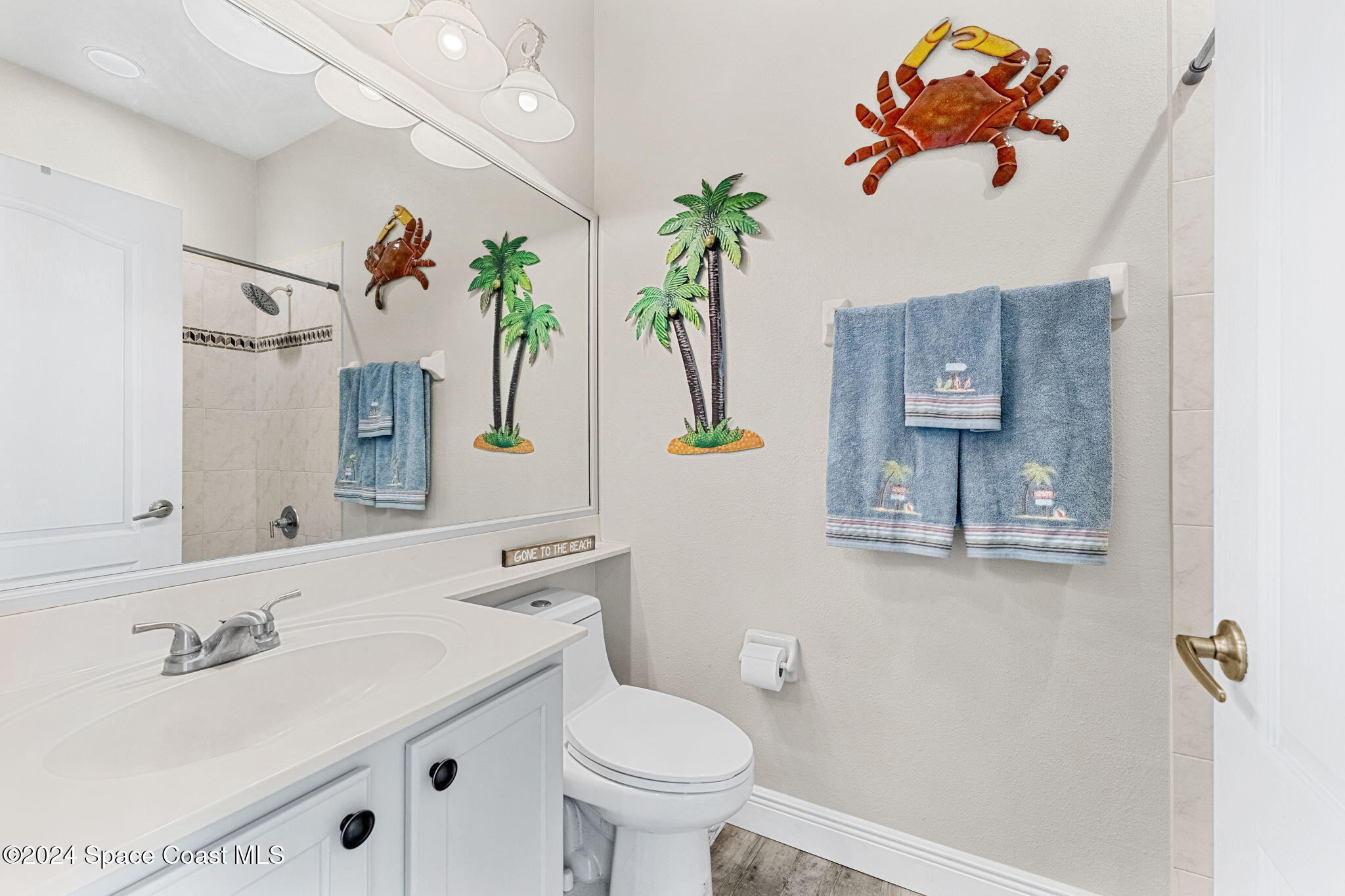3416 Peninsula Circle Melbourne, FL 32940 - Photo 26 of 61 a bathroom with a sink mirror and toilet